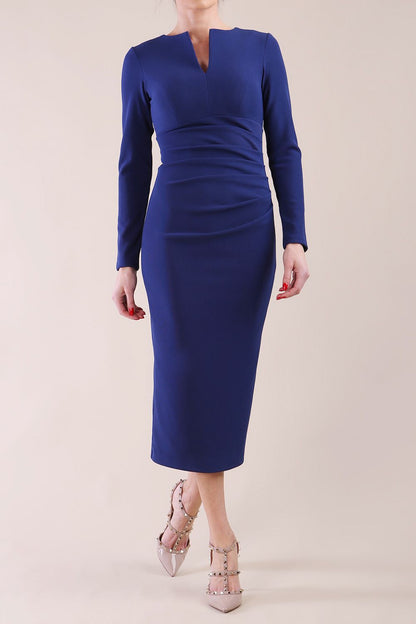 Model wearing diva catwalk Long Sleeved Lydia Midi pencil dress in Navy Blue