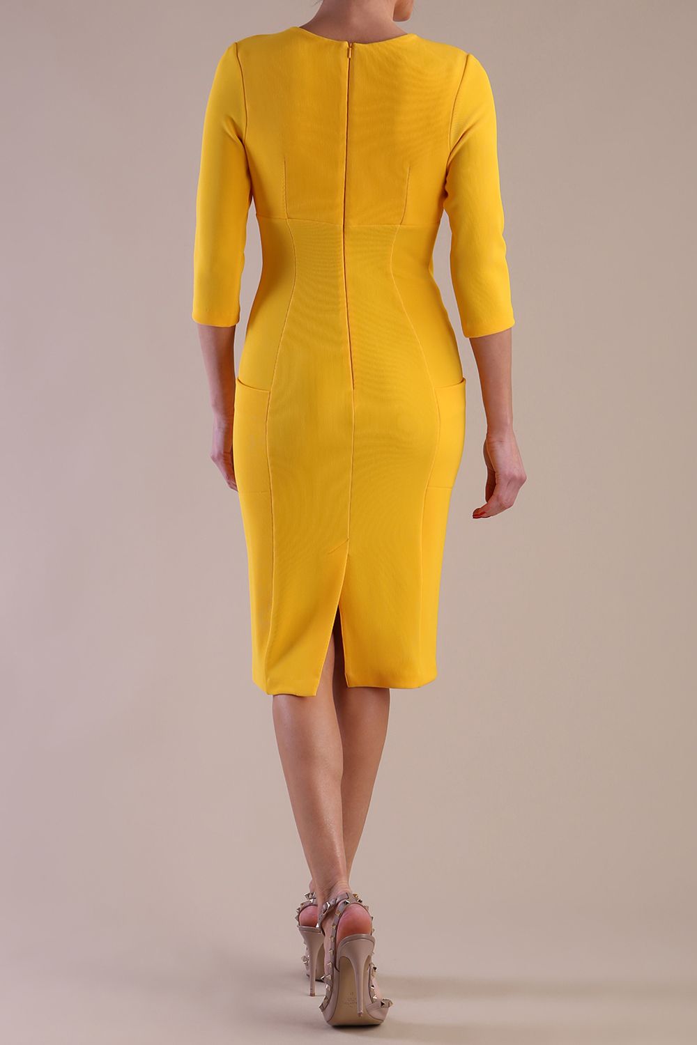 Model wearing diva catwalk Luna 3/4 Sleeved pencil skirt dress in Sunshine Yellow