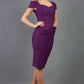 blonde model is wearing diva catwalk seed bonnie pencil skirt dress with cap sleeves and sweetheart neckline with pleating across the tummy in colour purple front