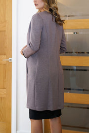 Model wearing the Diva Alverstone Coat in Mist Pink and black back image    