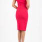 brunette model wearing diva catwalk rosita pencil skirt fitted dress with asymmetric neckline and bow detail at the top and it is a sleeveless design  with empire waistline in pink back