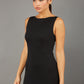 brunette model wearing diva catwalk plain pencil sleeveless dress in black colour front