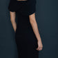 model wearing diva catwalk asymmetric neckline black short sleeve top back