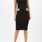 model wearing diva catwalk black and white tempo pencil dress with pocket detail and rounded neckline with bow detail front