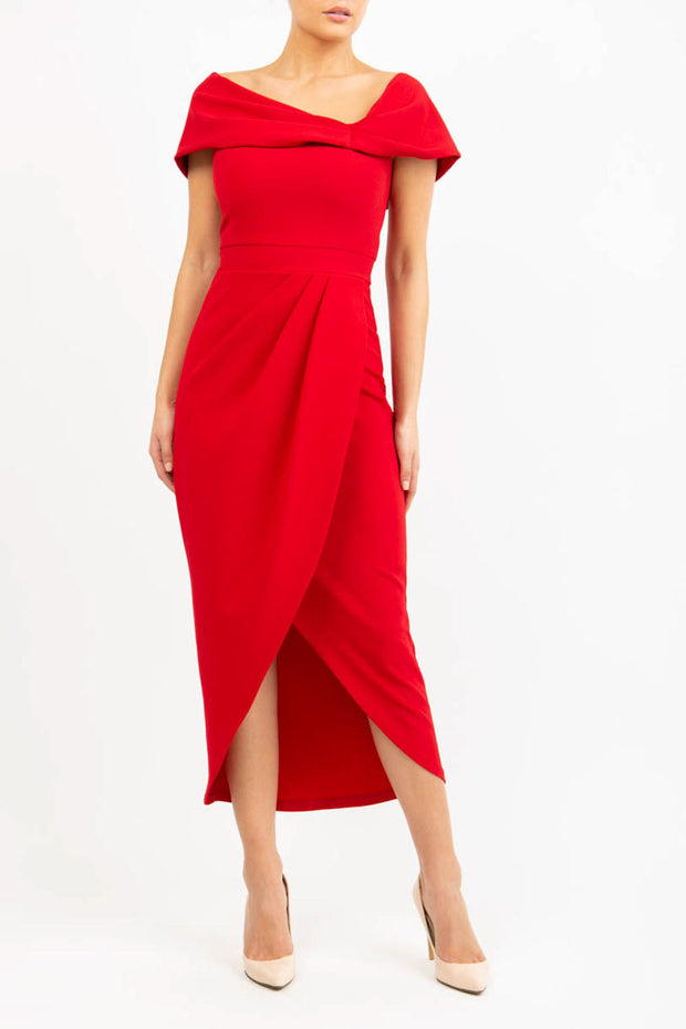 brunette model wearing diva catwalk vegas calf length scarlet red midaxi dress with wide bardot neckline and open shoulders with a large opening at the front of the skirt with pleating coming down long skirt front