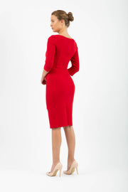 model is wearing diva catwalk jacky dress with rounded neckline 3/4 sleeve and bow detail on the waist in scarlet red back