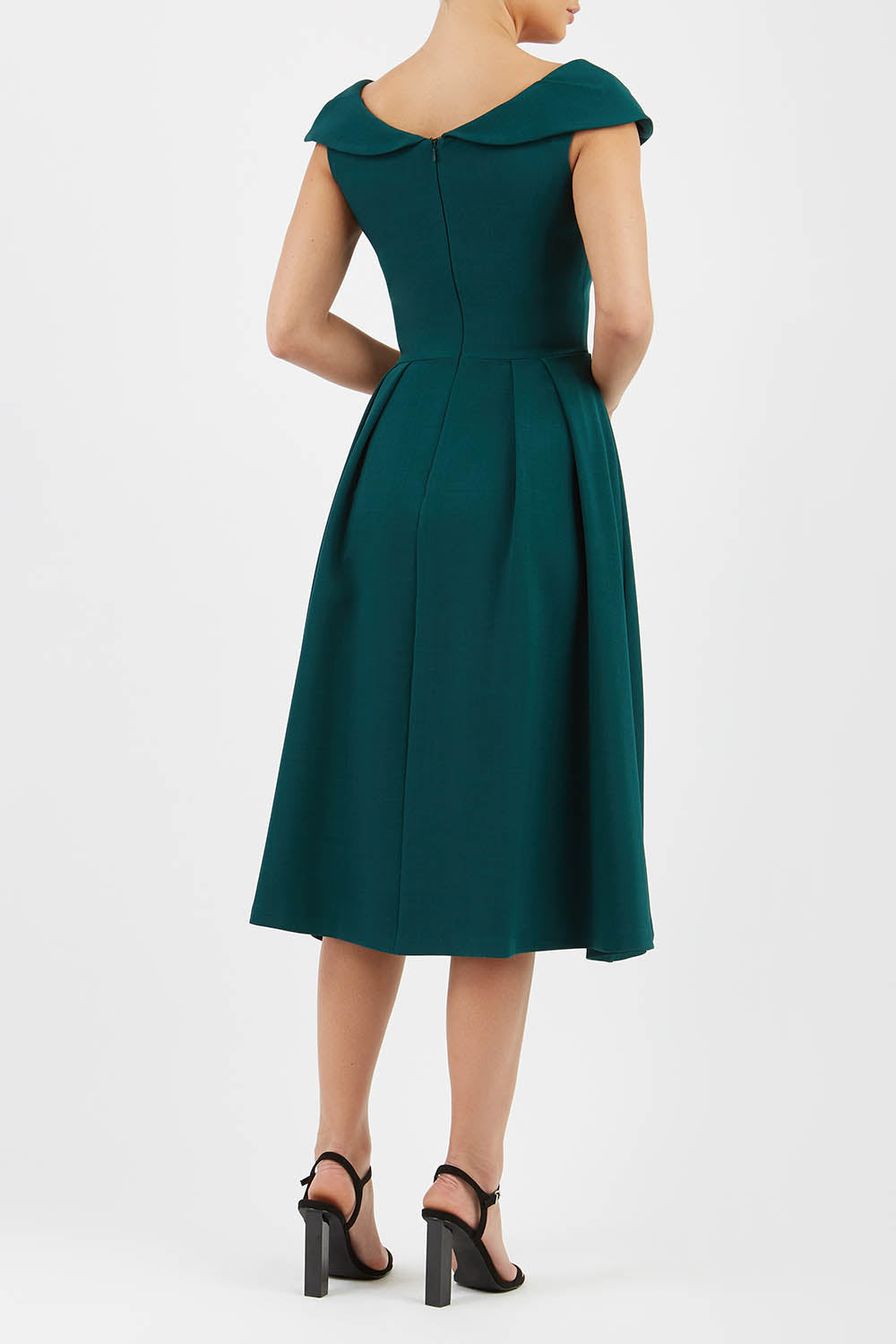 Model wearing the Diva Chesterton Sleeveless dress with oversized collar detail and swing pleated skirt in forest green back image