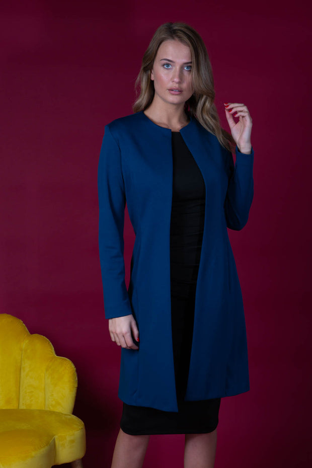 model wearing diva catwalk navy blue coat with long sleeves and a belt front