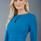 model wearing diva catwalk ubrique pencil dress with a keyhole detail and sleeves in teal colour front