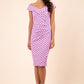 Brunette model wearing Diva Catwalk Fenella Polka Dot Pencil Sleeveless Dress off shoulder bardot neckline in pink front