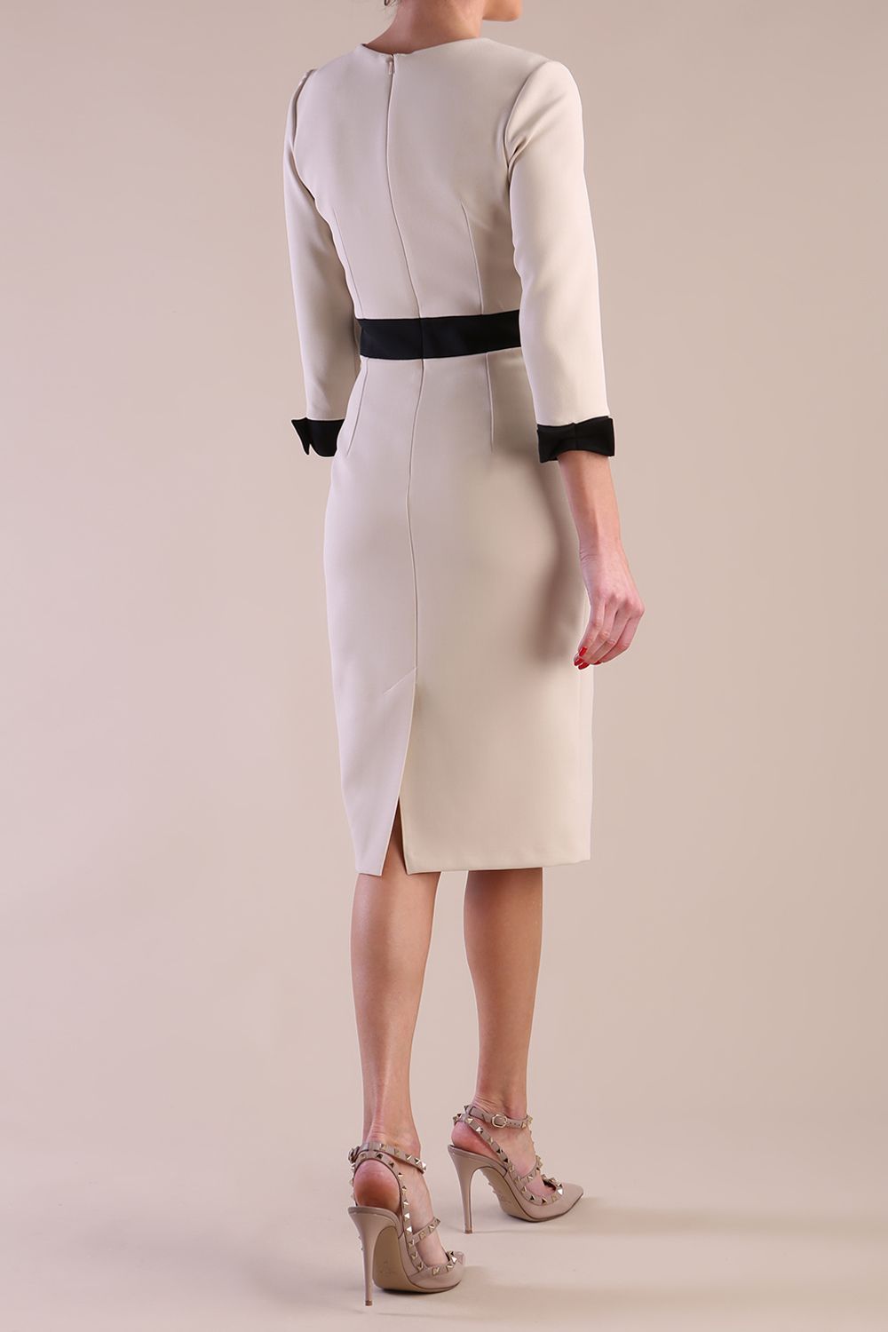 Back Image of Model wearing diva catwalk Reese 3/4 Sleeved pencil skirt dress with a contrast sleeve and waistband details in Sandshell Beige/Black
