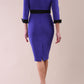 Back Image of Model wearing diva catwalk Reese 3/4 Sleeved pencil skirt dress with a contrast sleeve and waistband details in Indigo Blue/Black