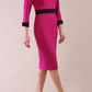 Model wearing diva catwalk Reese 3/4 Sleeved pencil skirt dress with a contrast sleeve and waistband details in Magenta/Black