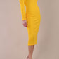 Model wearing DIVA Catwalk Faye Off Shoulder Long Sleeve Midi Pencil Dress in Sunshine Yellow colour front side