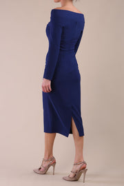 Model wearing DIVA Catwalk Faye Off Shoulder Long Sleeve Midi Pencil Dress in Navy Blue colour back side