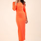 brunette model wearing diva catwalk maxi plain three quarter sleeve dress with pleating on shoulders and square neckline in hot coral front