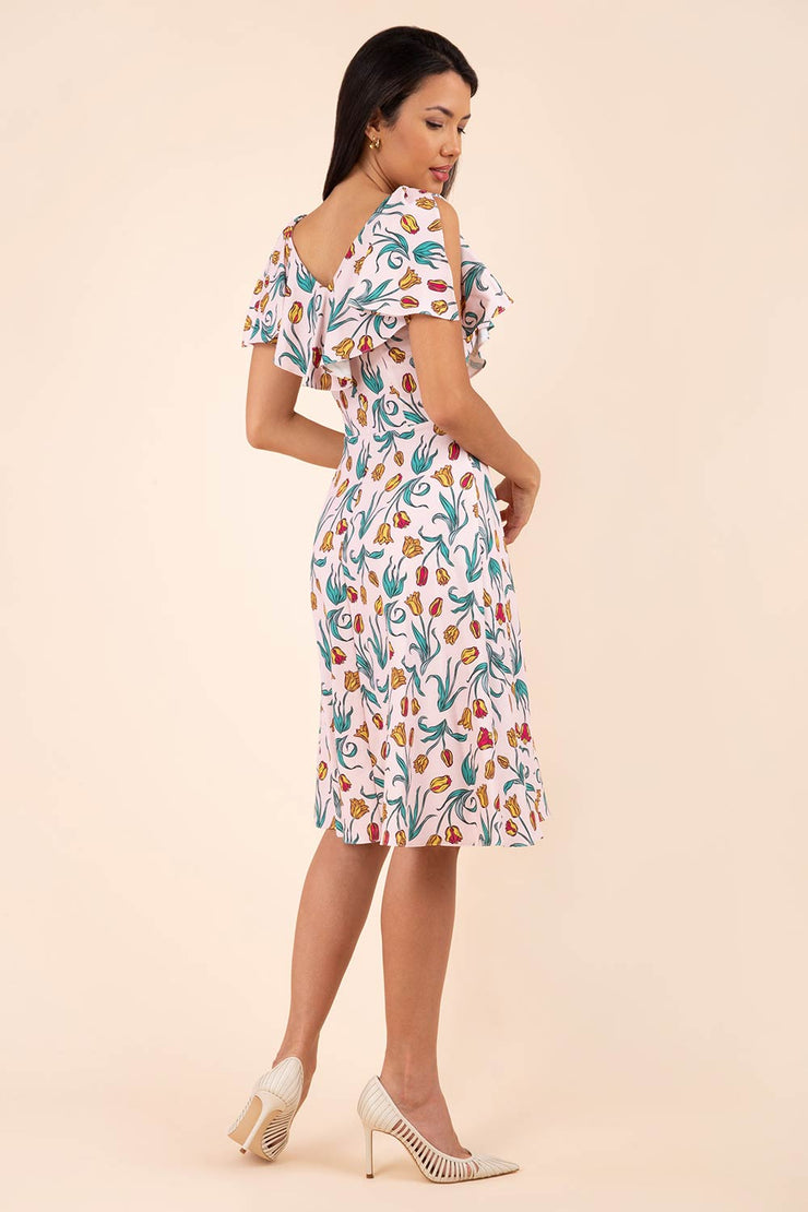 model is wearing diva catwalk layla a-line swing printed dress without sleeves in linear tulip print back