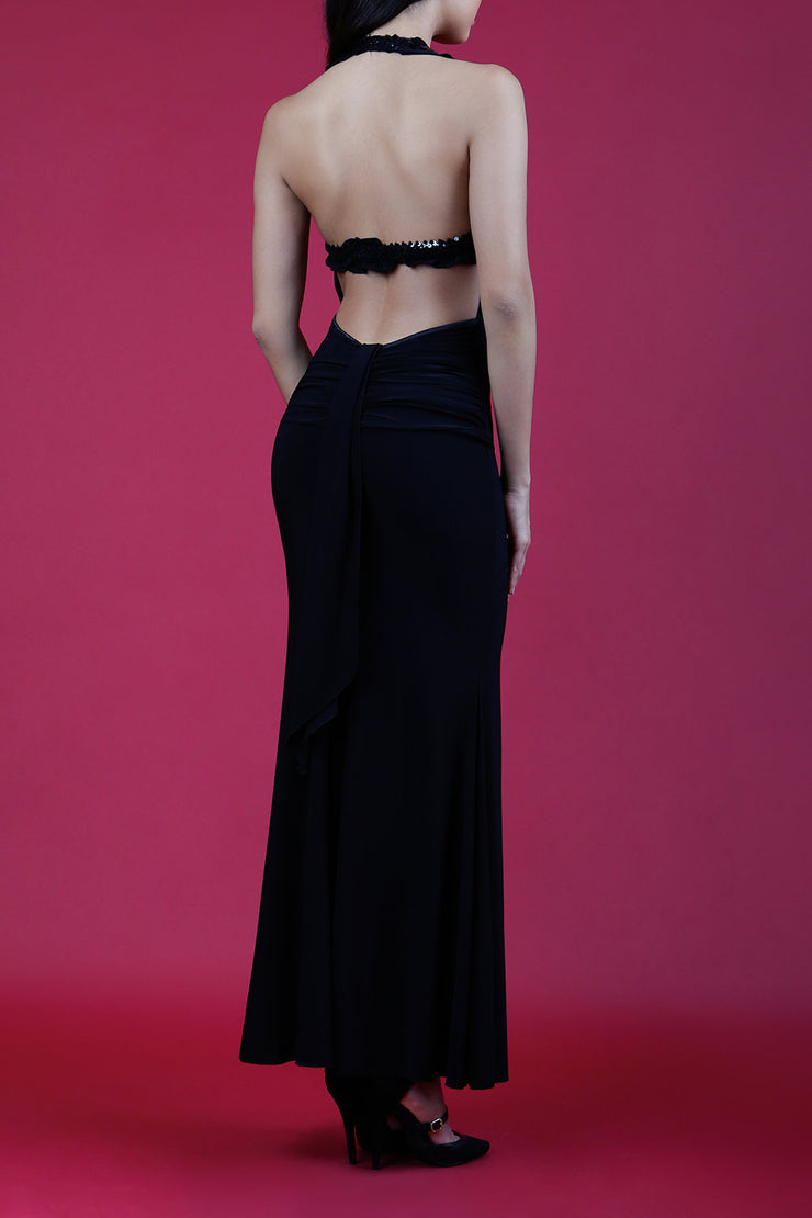 Model wearing Afterdark Full Length Sleeveless Open U-shape Back and Cowl neckline Dress with and Sequined straps over neckline and back in Black back