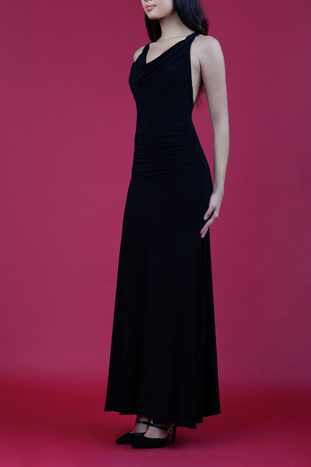 Model wearing Daring Full Length Sleeveless Open U-shape x-cross detailed Back  and Cowl neckline Dress in Black front