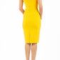 brunette model wearing diva catwalk beyonce pencil fitted dress with high neckline without sleeves with a wide band and pleating across the tummy area with a crossed detail neckline in sunshine yellow back