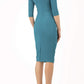 Model wearing the Diva Carlotta Pencil dress with pleat detail at the neckline and across the front in mosaic blue back image