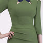 Model wearing the Diva Carolina ¾ sleeve Dress with cut out neckline detail in vineyard green and navy front image