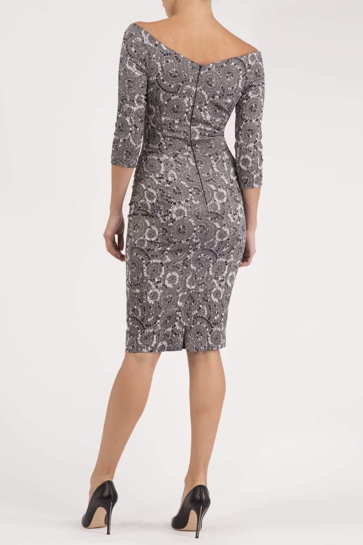 Model wearing the Diva Catherine Jacquard dress with overlapping bodice in circle grey back image