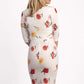 Model wearing the Diva Cynthia Floral Print dress with pleating across the front in buttercup print back image