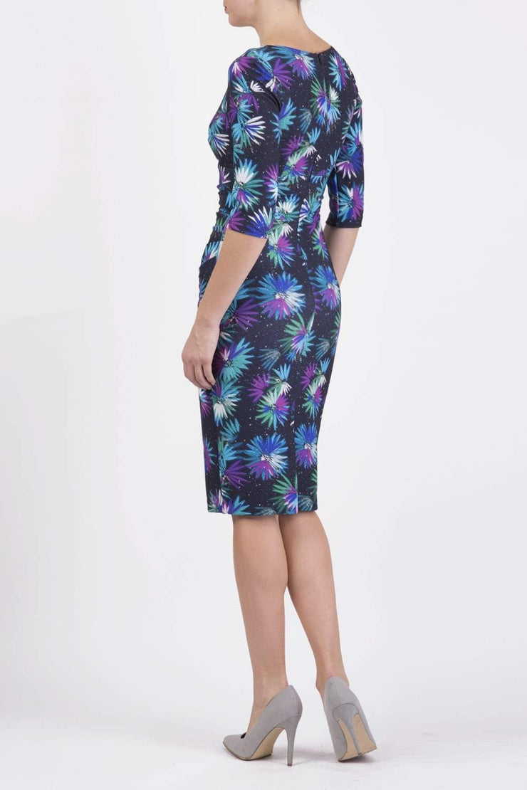 Model wearing the Diva Cynthia Floral Print dress with pleating across the front in Floral splash print back image