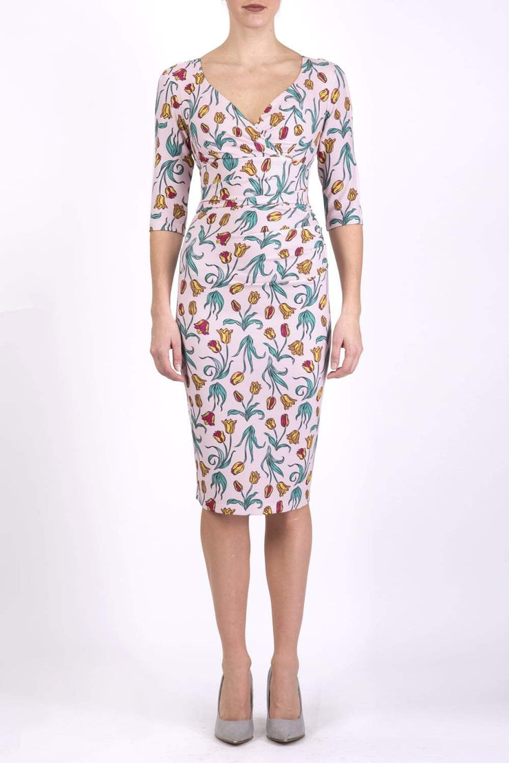 Model wearing the Diva Cynthia Floral Print dress with pleating across the front in linear tulip print front image