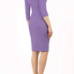 model wearing diva catwalk donna pencil dress in colour purple with wide band and sleeves and rounded neckline with low split in front back