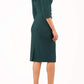 model is wearing diva catwalk eliza sleeved pencil dress with collared v-neck in forest green back