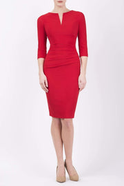 brunette model wearing diva catwalk best selling lydia pencil sleeved dress with slit at the neckline and pleating across the tummy in colour nrue red front