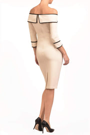 A Model is wearing an off shoulder three quarter sleeve pencil dress in cream by diva catwalk