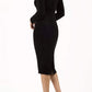 blonde model wearing diva catwalk black pencil dress called trocadero pencil midaxi style with funnel neckline and lace detail and long sleeves back