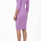 model wearing diva catwalk york pencil-skirt dress with sleeves and rounded folded collar and plearing across the tummy area in violet bloom colour back