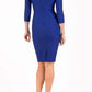 model wearing diva catwalk york pencil-skirt dress with sleeves and rounded folded collar and plearing across the tummy area in cobalt blue colour back