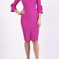 blonde model wearing diva catwalk zoe 3 4 sleeve formal dress with a split rounded neckline and split on skirt in pink colour front