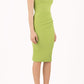 Model wearing the Diva Banbury gathered dress in bodycon pencil dress design in jasmine green front