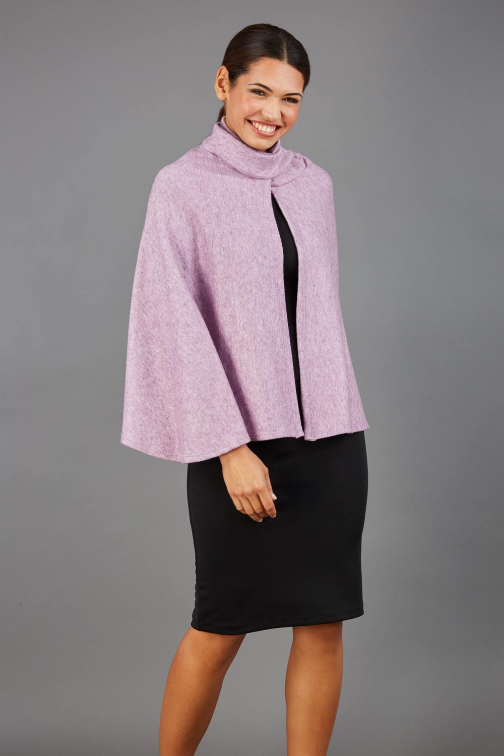 brunette model wearing diva catwalk hampstead cape known as shawl high neck in pink front
