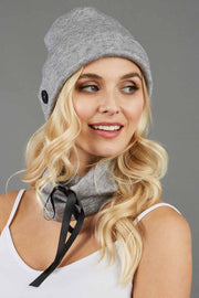 blonde model is wearing diva catwalk rappa soft neck warmer in grey front paired with diva grey hat