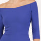 brunette model is wearing diva catwalk off shulder swing a-line islay dress with sleeves in riviera blue front close up
