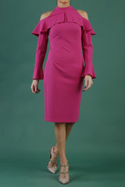 brunette model is wearing diva catwalk liah long sleeve cold-shoulder pencil dress with high neck in pink front
