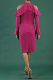 brunette model is wearing diva catwalk liah long sleeve cold-shoulder pencil dress with high neck in pink back