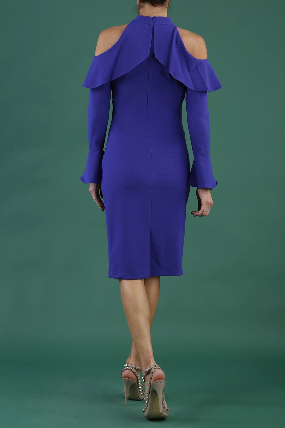 brunette model is wearing diva catwalk liah long sleeve cold-shoulder pencil dress with high neck in spectrum indigo back