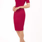 blonde model is wearing diva catwalk lydia short sleeve pencil fitted dress in red colour with rounded neckline with a slit in the middle front