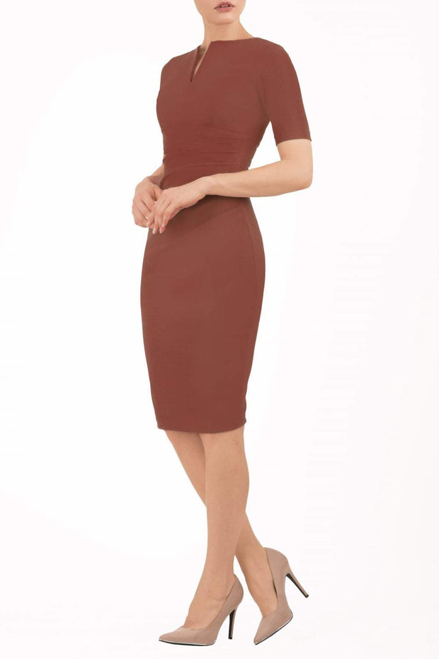 model is wearing diva catwalk lydia short sleeve pencil fitted dress in brown colour with rounded neckline with a slit in the middle back