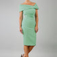 blonde model is wearing diva catwalk mariposa pencil dress with Detailed Bardot neckline with fold-over detail and pleated at waist area in mint green front