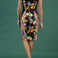 model wearing Diva catwalk Rita pencil sleeveless dress with rounded neckline in floral print and black back