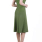 model wearing diva catwalk rochelle swing skirt a line dress without sleeves with a low v neck in apple green side 